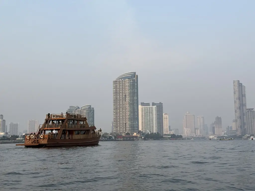 River boat and Bangkok skyline along the Chao Phraya